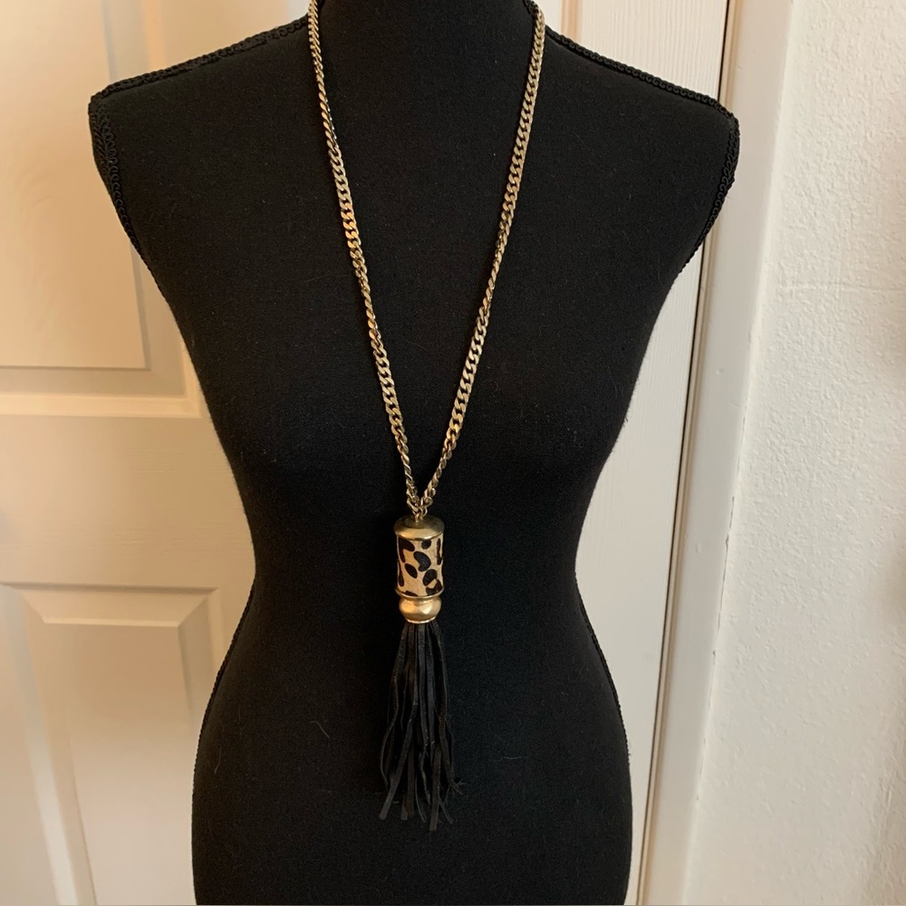 Chicos gold tone chain necklace. Black leather tassel. Leopard print pendant